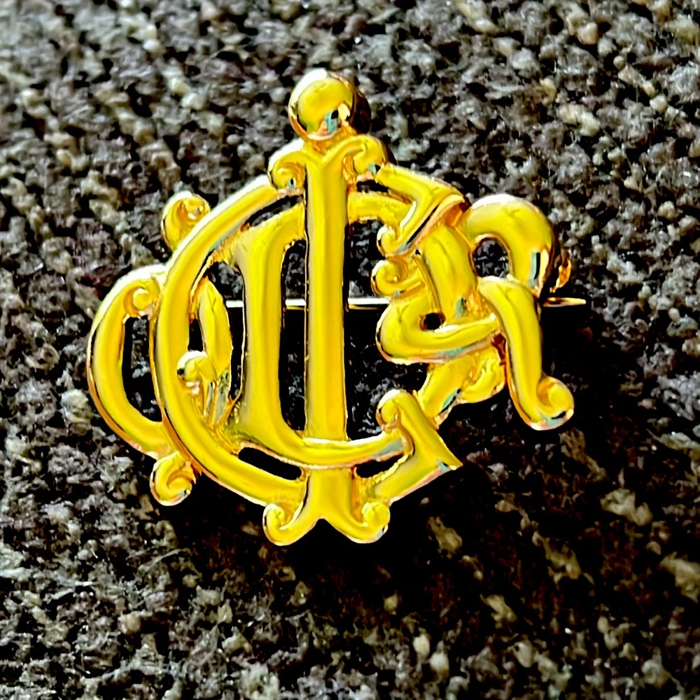 Christian Dior 18K electroplate gold pin.